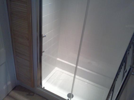 Bath removed, shower and cupboard installed