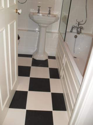 Picture of bathroom with black and white chequered floor