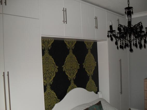 Picture of fitted wardrobe with over bed storage